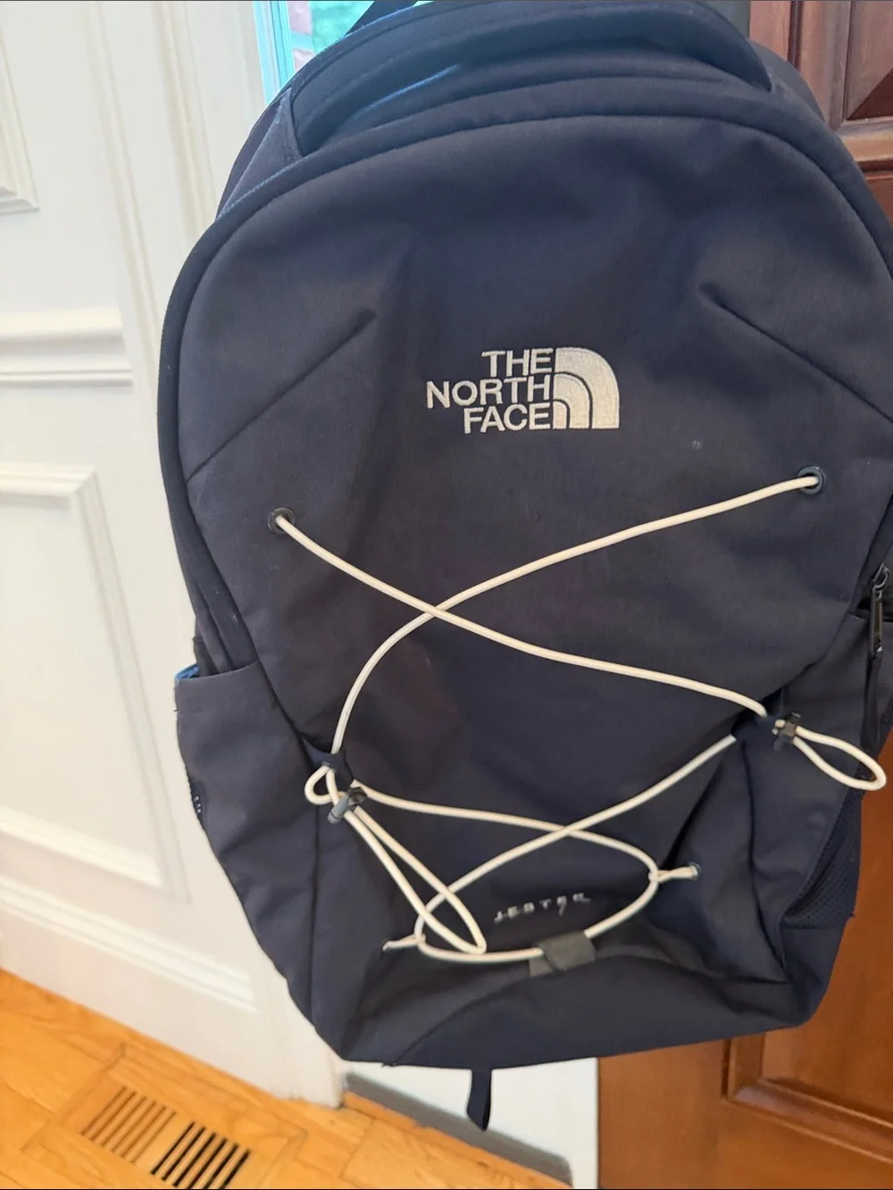 The North Face Navy Blue Backpack with White Bungee Cord